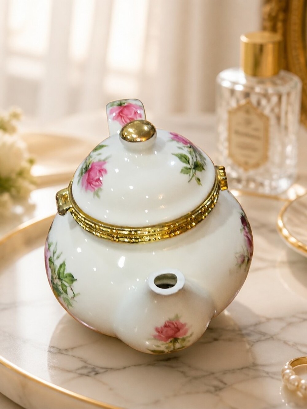 The trinket box is made of glazed porcelain (ceramic). Victorian Rose collection